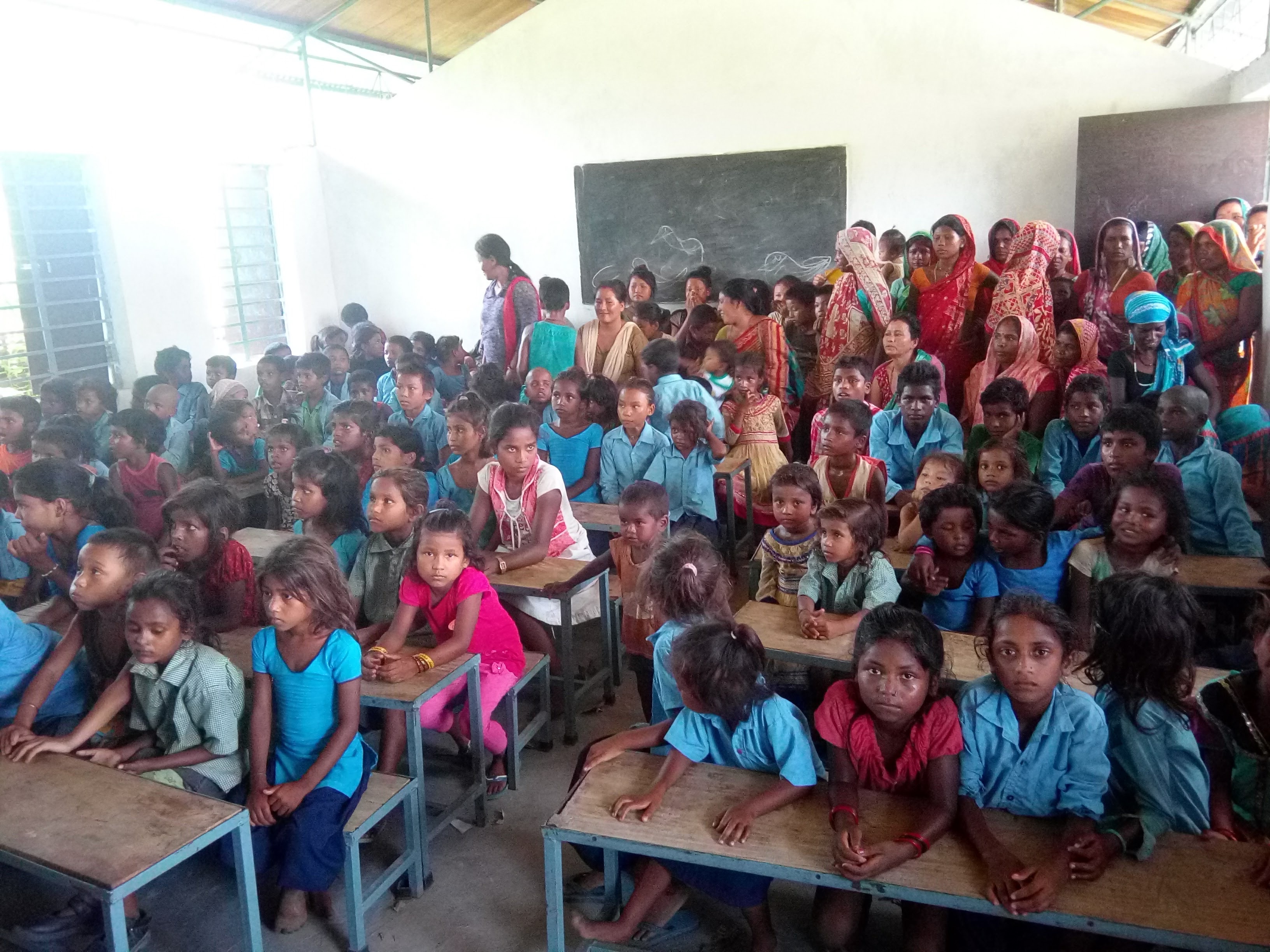 Students sitting together in a rural classroom