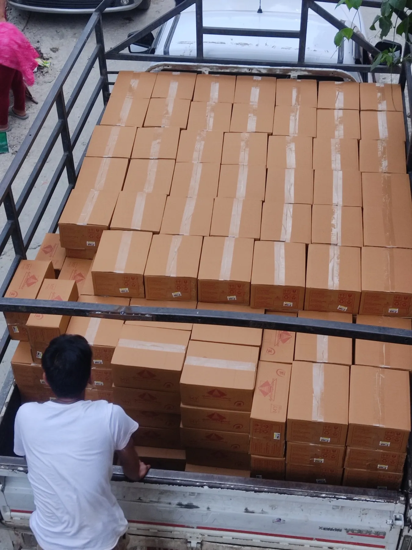Sealed cartons of My Pickle House jars filling a truck before the first shipment to Australia